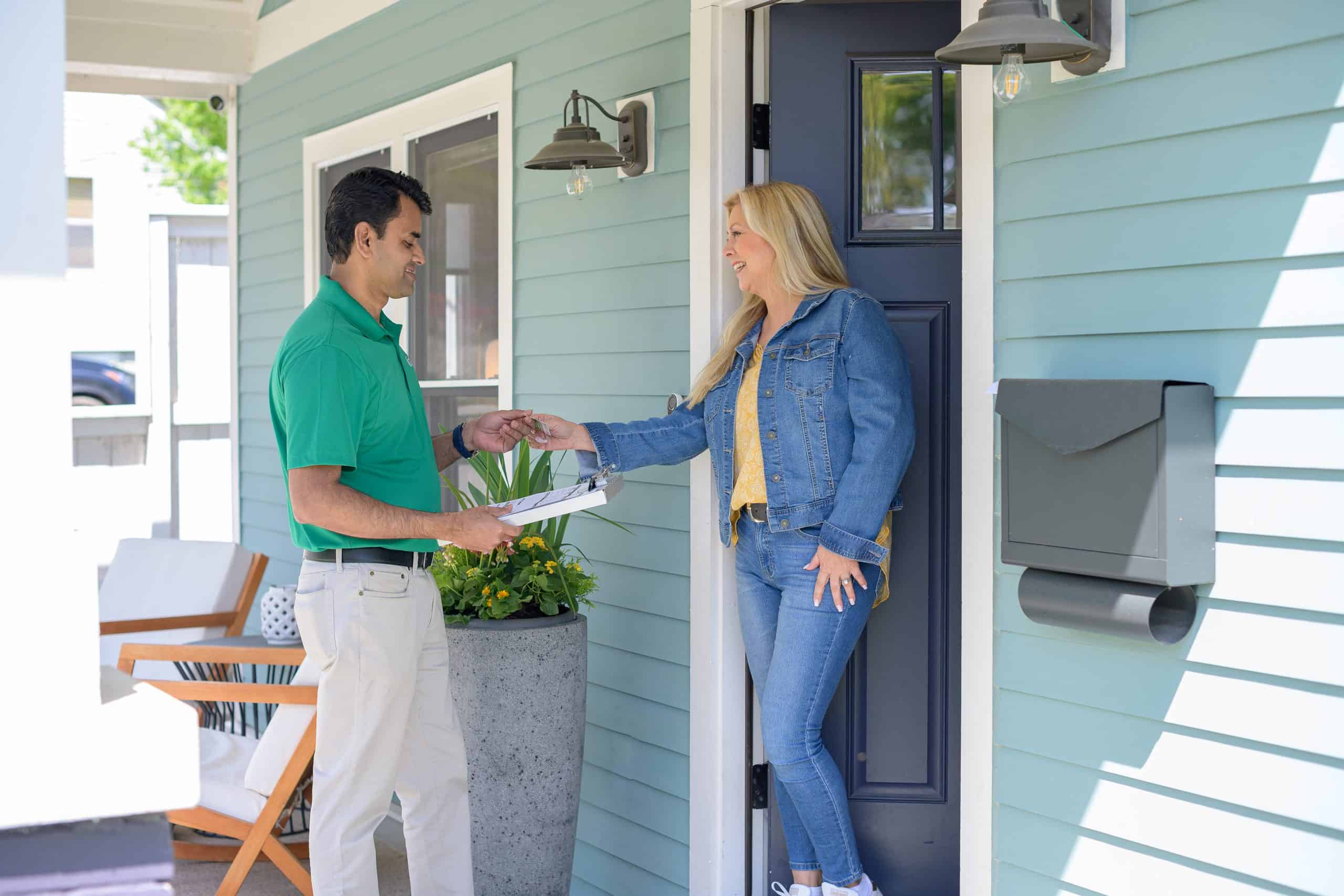 A OK Quick-Dry technician greeting a homeowner