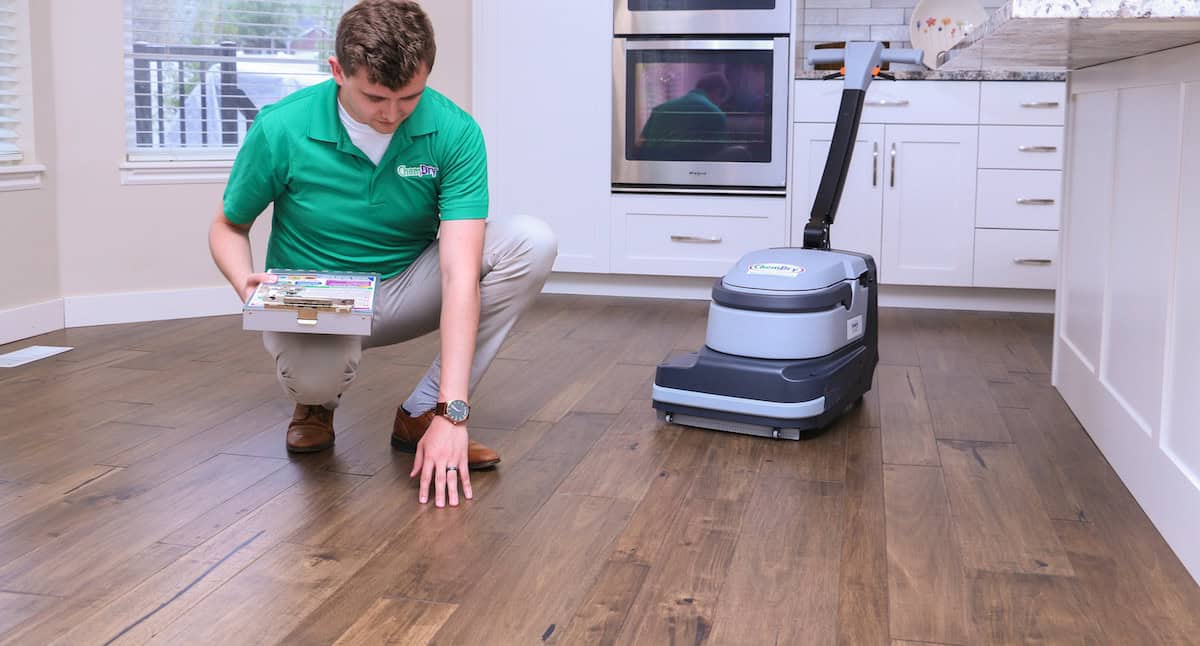 Professional wood floor cleaning service restoring hardwood without sanding