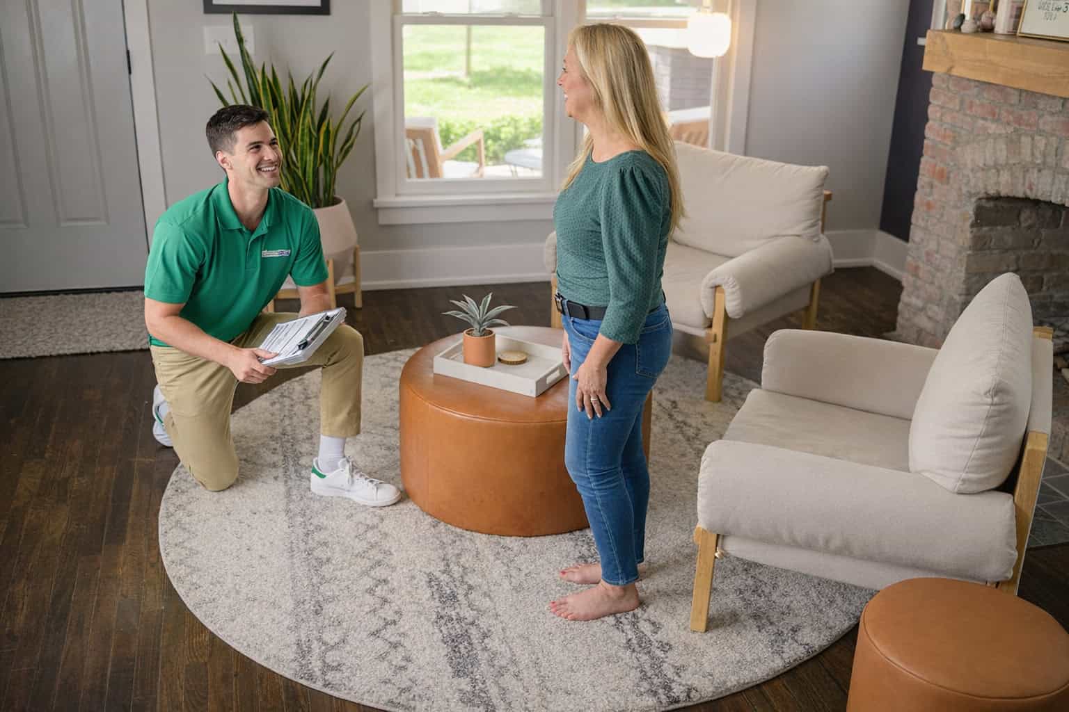 Technician cleaning an area rug inside a home in Barrington, IL