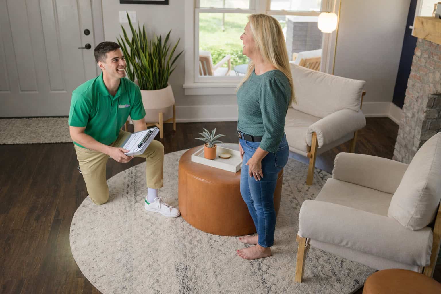 Technician cleaning an area rug inside a home in Elgin, IL