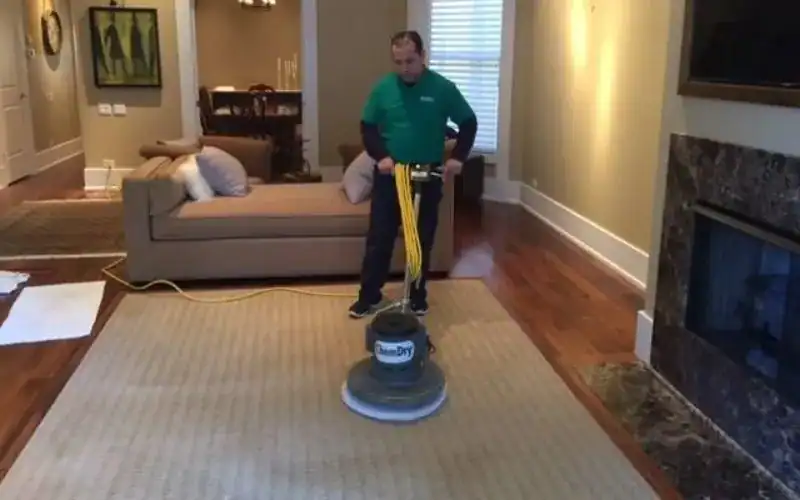 Quick-Dry technician cleaning an area rug inside a home in Gurnee, IL