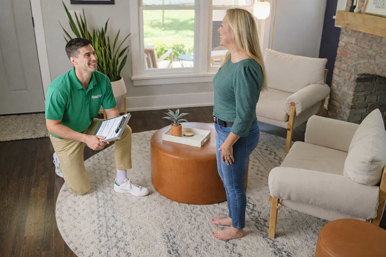 Technician cleaning an area rug inside a home in Hampshire, IL