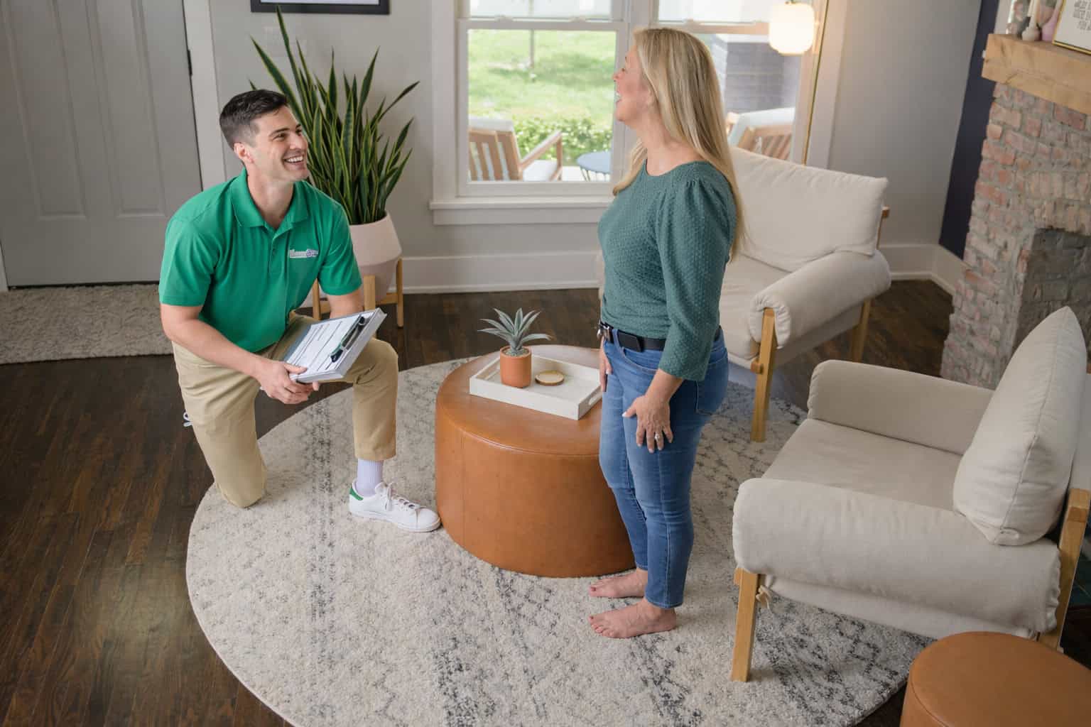 Technician cleaning an area rug inside a home in Rolling Meadows, IL
