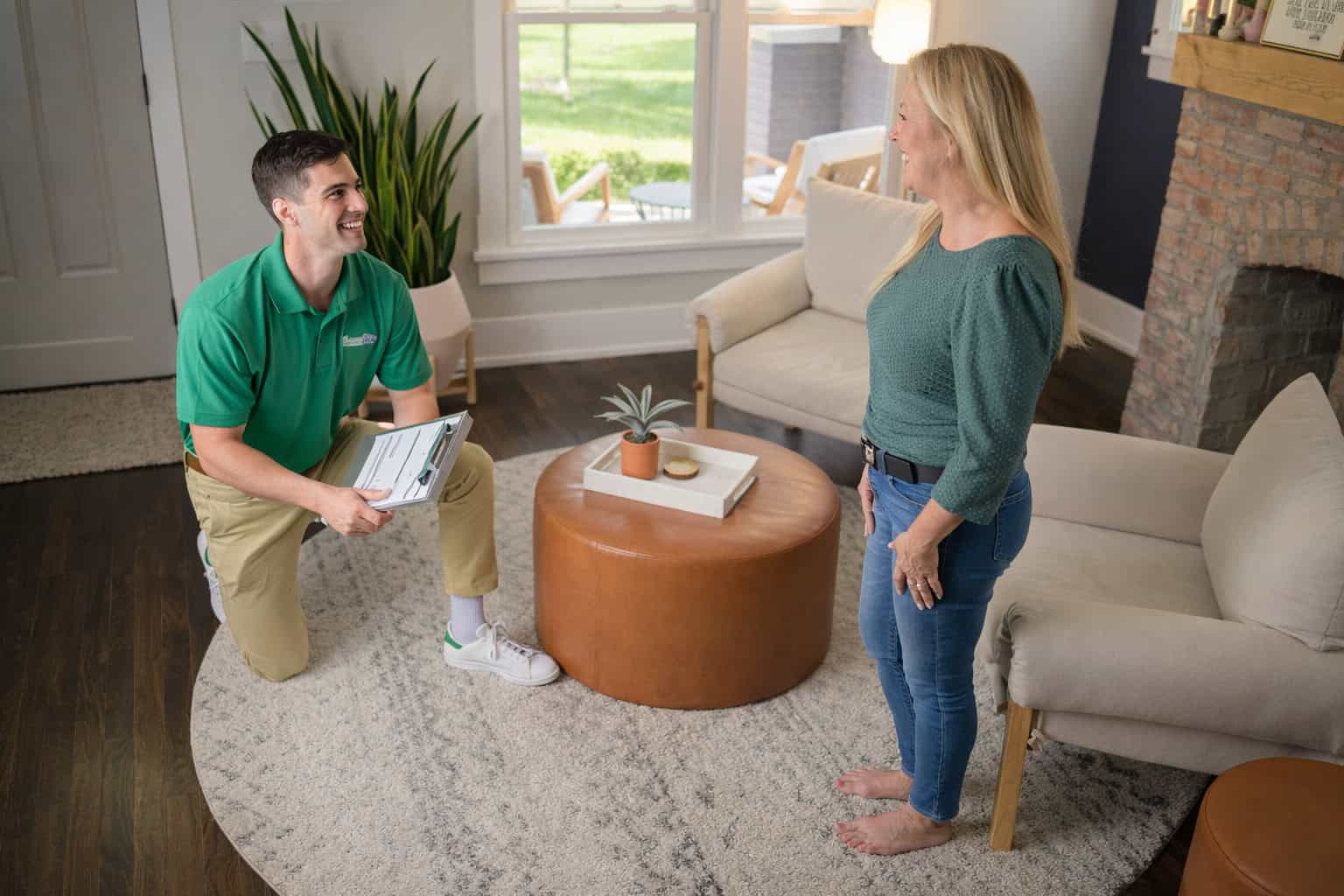 Technician cleaning an area rug inside a home in Schaumburg, IL