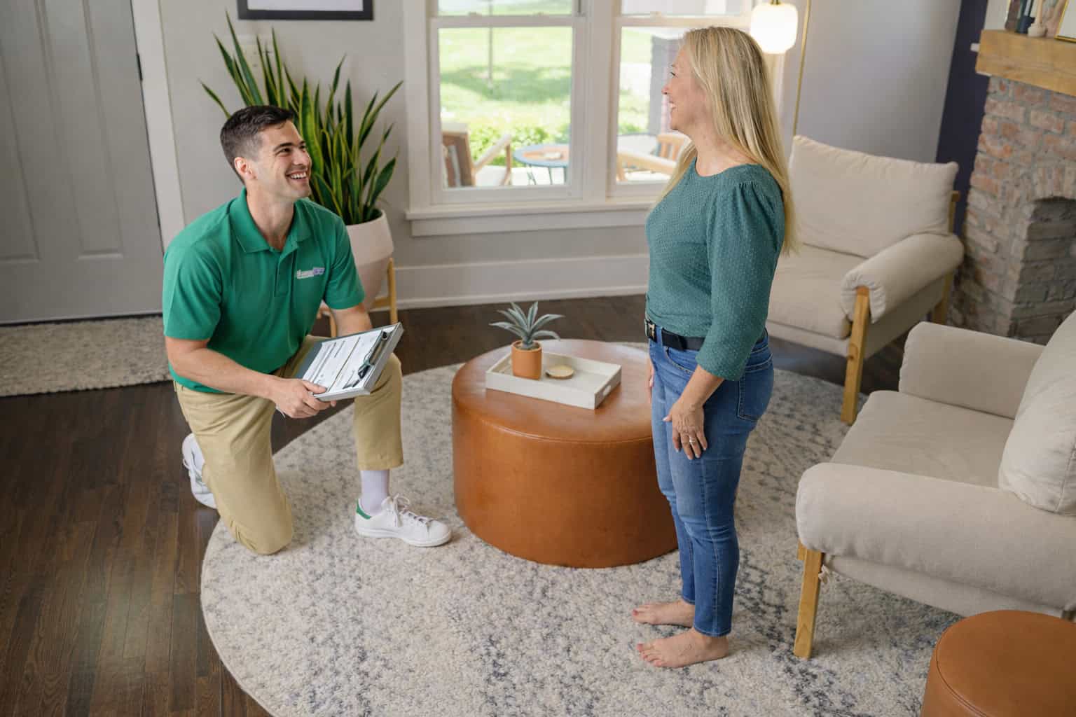 Technician cleaning an area rug inside a home in South Elgin, IL