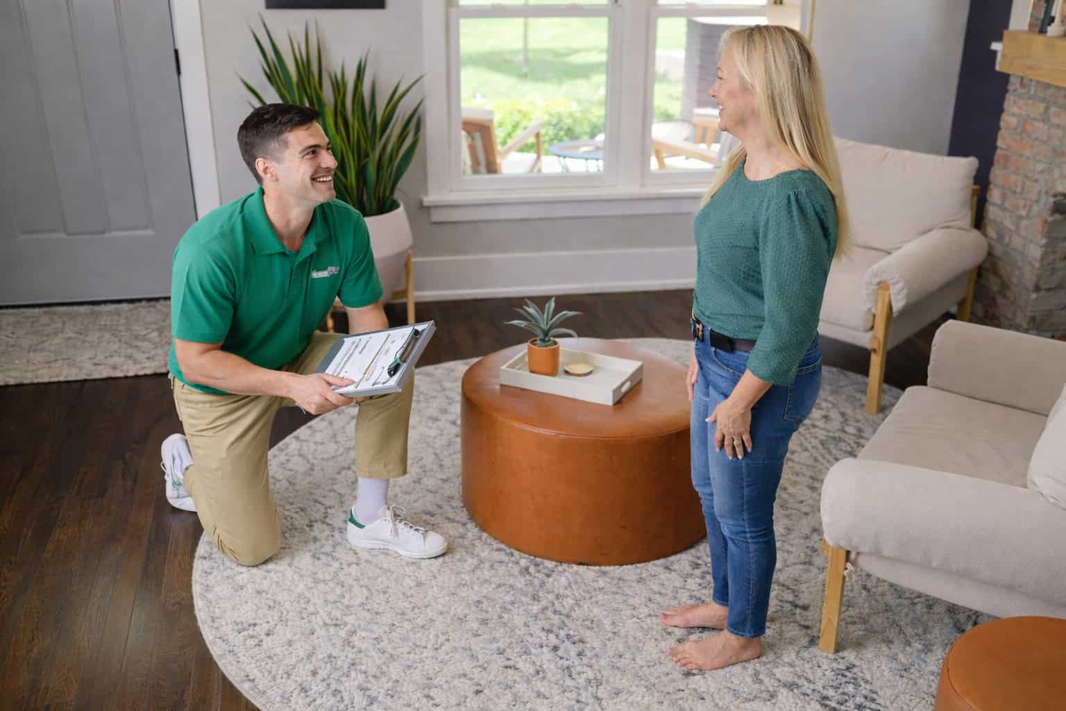Technician cleaning an area rug inside a home in West Dundee, IL